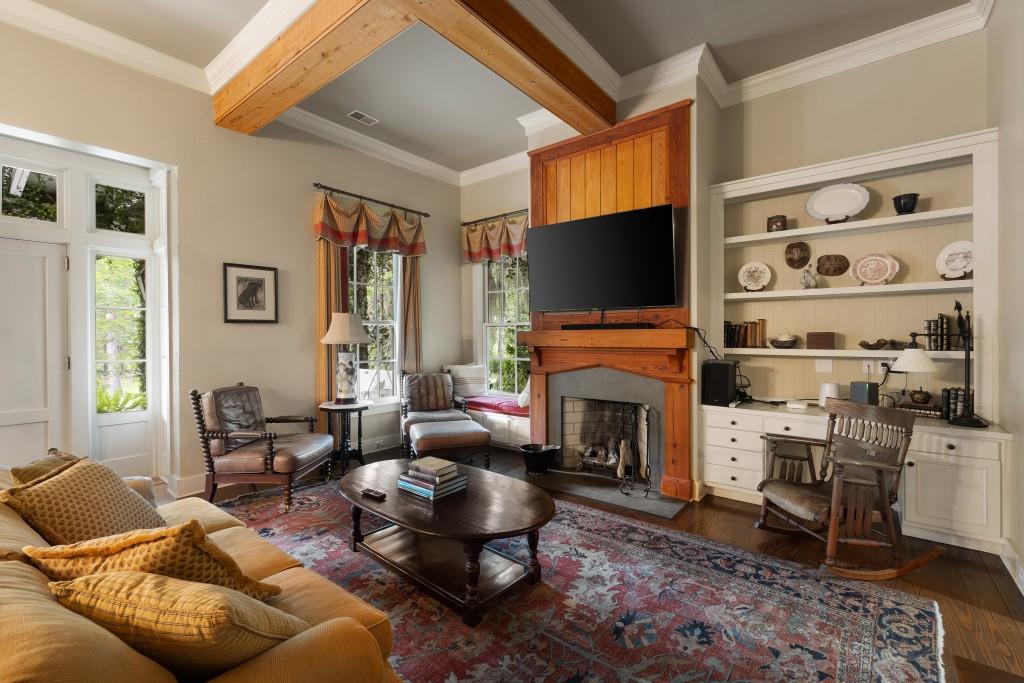 1300 Retreat Road Riceboro, GA 31323 - Photo 42 of 91 a living room with furniture a fireplace and a flat screen tv