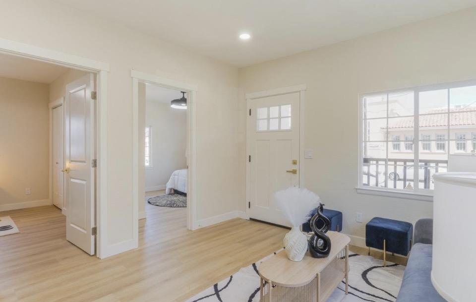 735 Locust Street San Jose, CA 95110 - Photo 7 of 21 a living room with furniture and a window