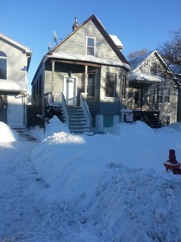 a view of a house with yard and sitting area