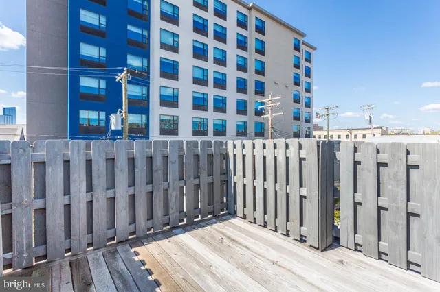 a front view of a building with a yard