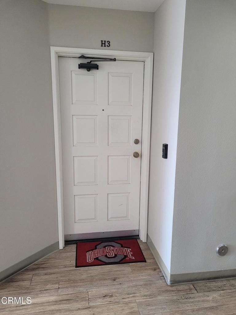 865 South B Street, Unit H3 Oxnard, CA 93030 - Photo 2 of 15 a view of a hallway with wooden floor