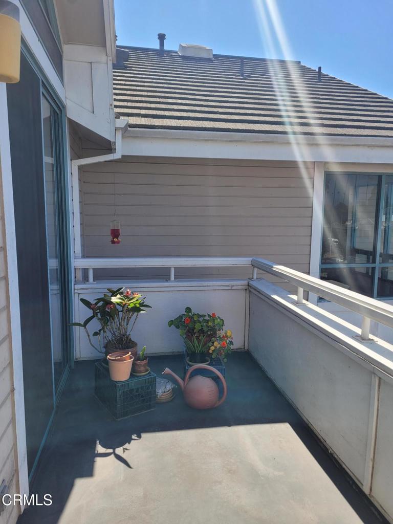 865 South B Street, Unit H3 Oxnard, CA 93030 - Photo 4 of 15 a view of table and chair in the balcony