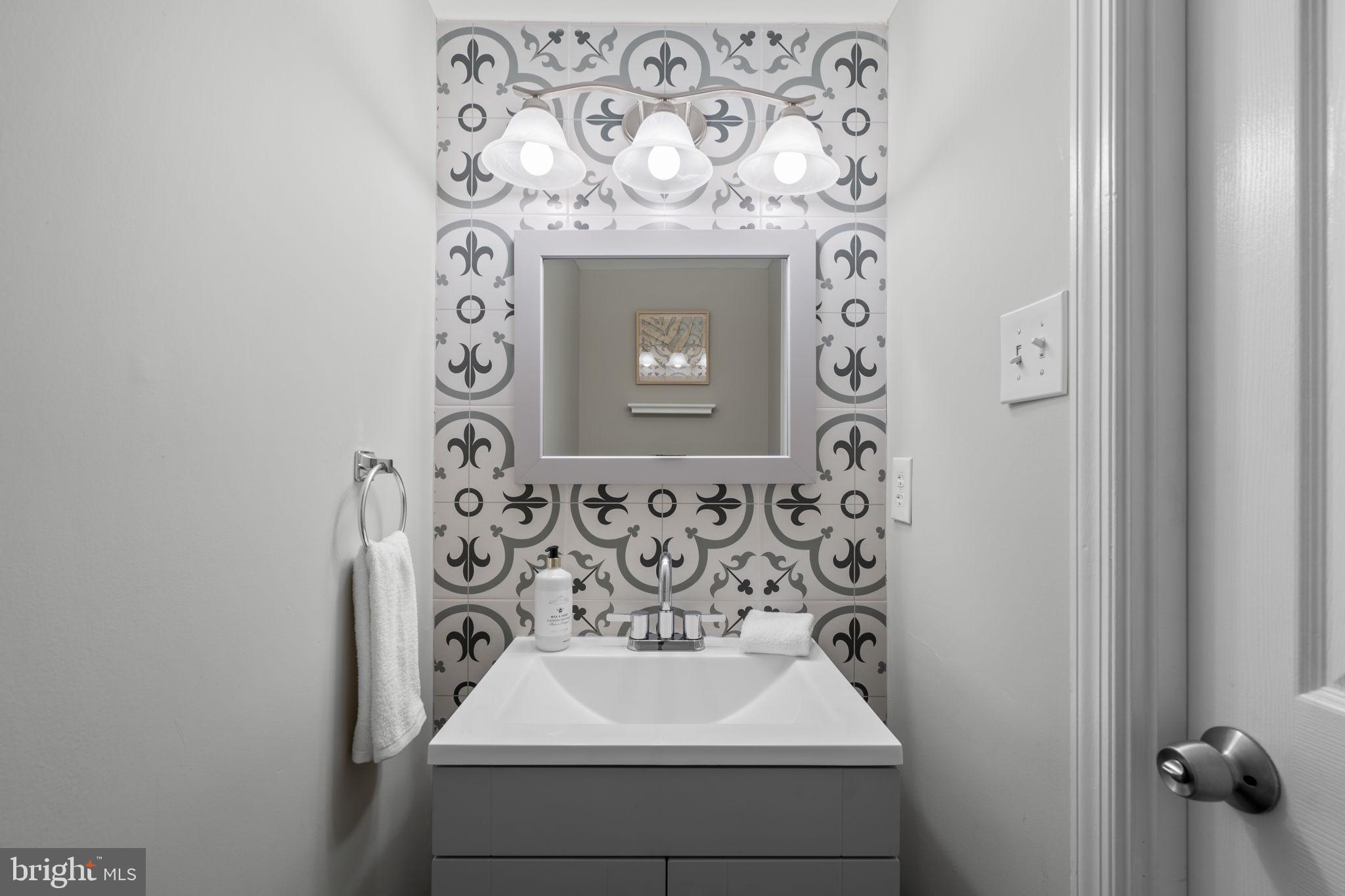 3050 Seminole Road Woodbridge, VA 22192 - Photo 12 of 35 a bathroom with a sink and a mirror