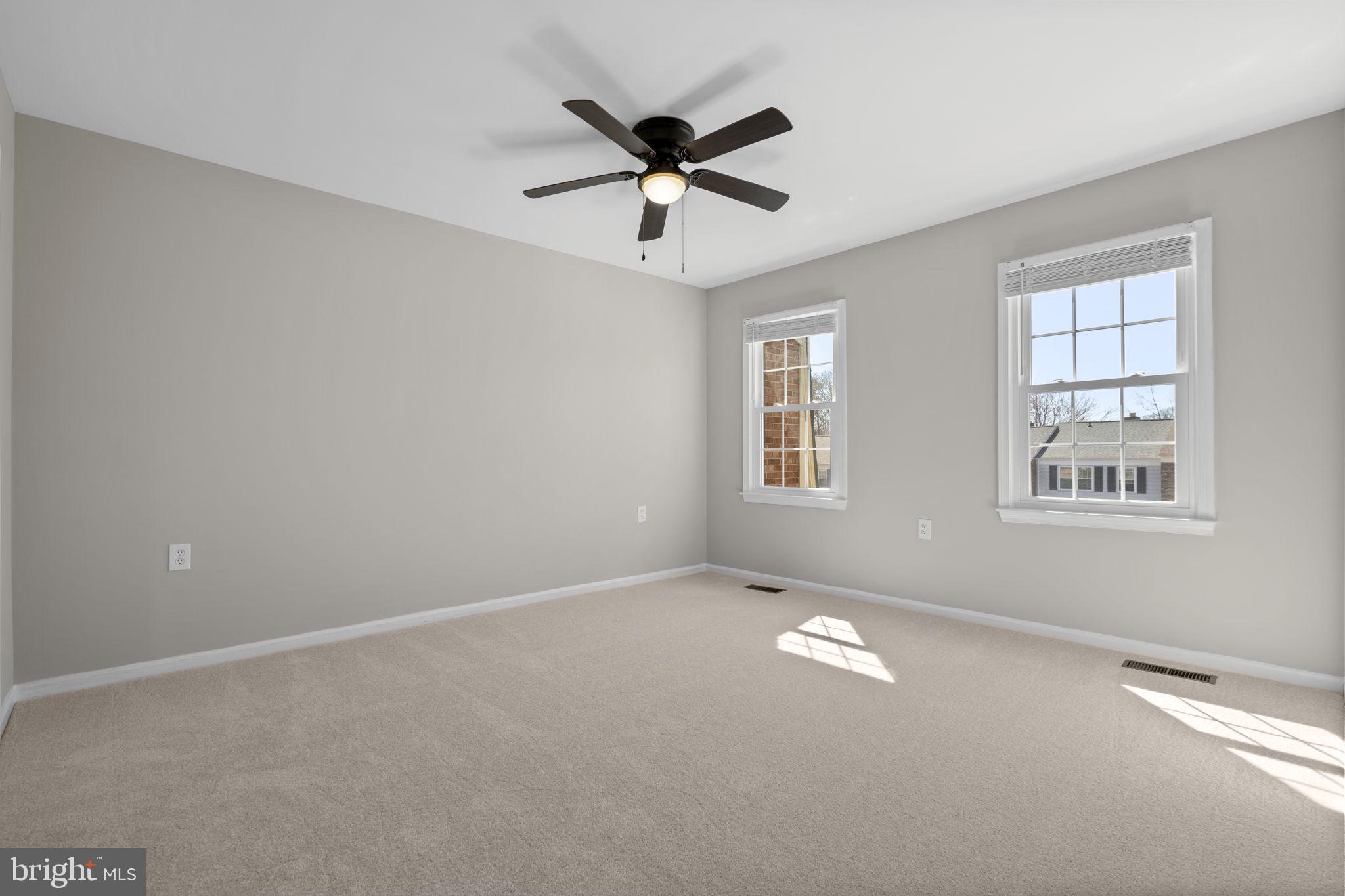 3050 Seminole Road Woodbridge, VA 22192 - Photo 13 of 35 an empty room with windows and ceiling fan