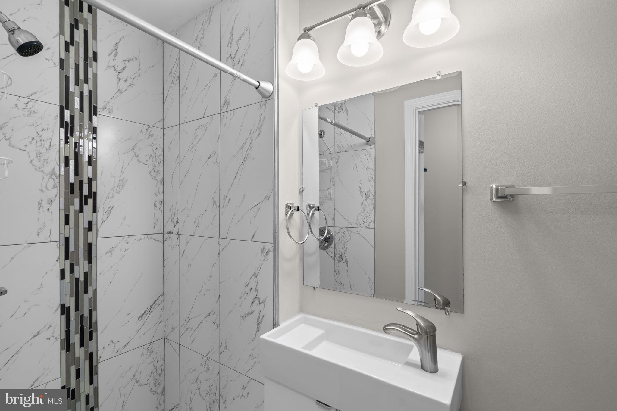 3050 Seminole Road Woodbridge, VA 22192 - Photo 22 of 35 a bathroom with a bathtub and a shower