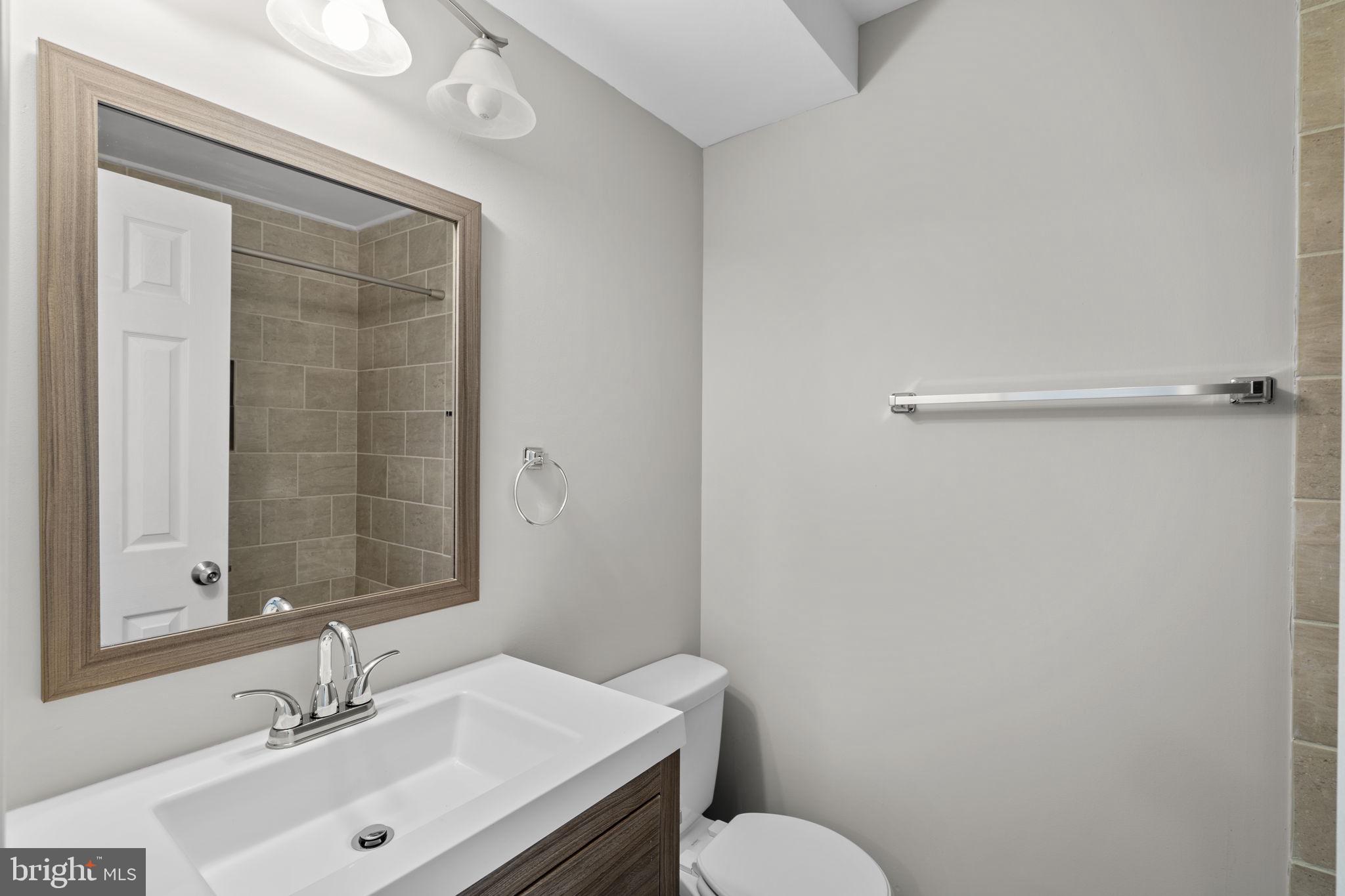 3050 Seminole Road Woodbridge, VA 22192 - Photo 28 of 35 a bathroom with a sink and a mirror