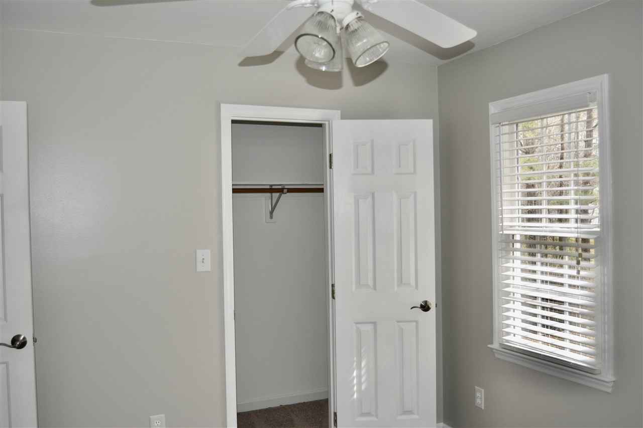 1625 Martin Pond Road Wendell, NC 27591 - Photo 22 of 30 2nd bedroom with ceiling fan & looks outback. 2nd bedroom