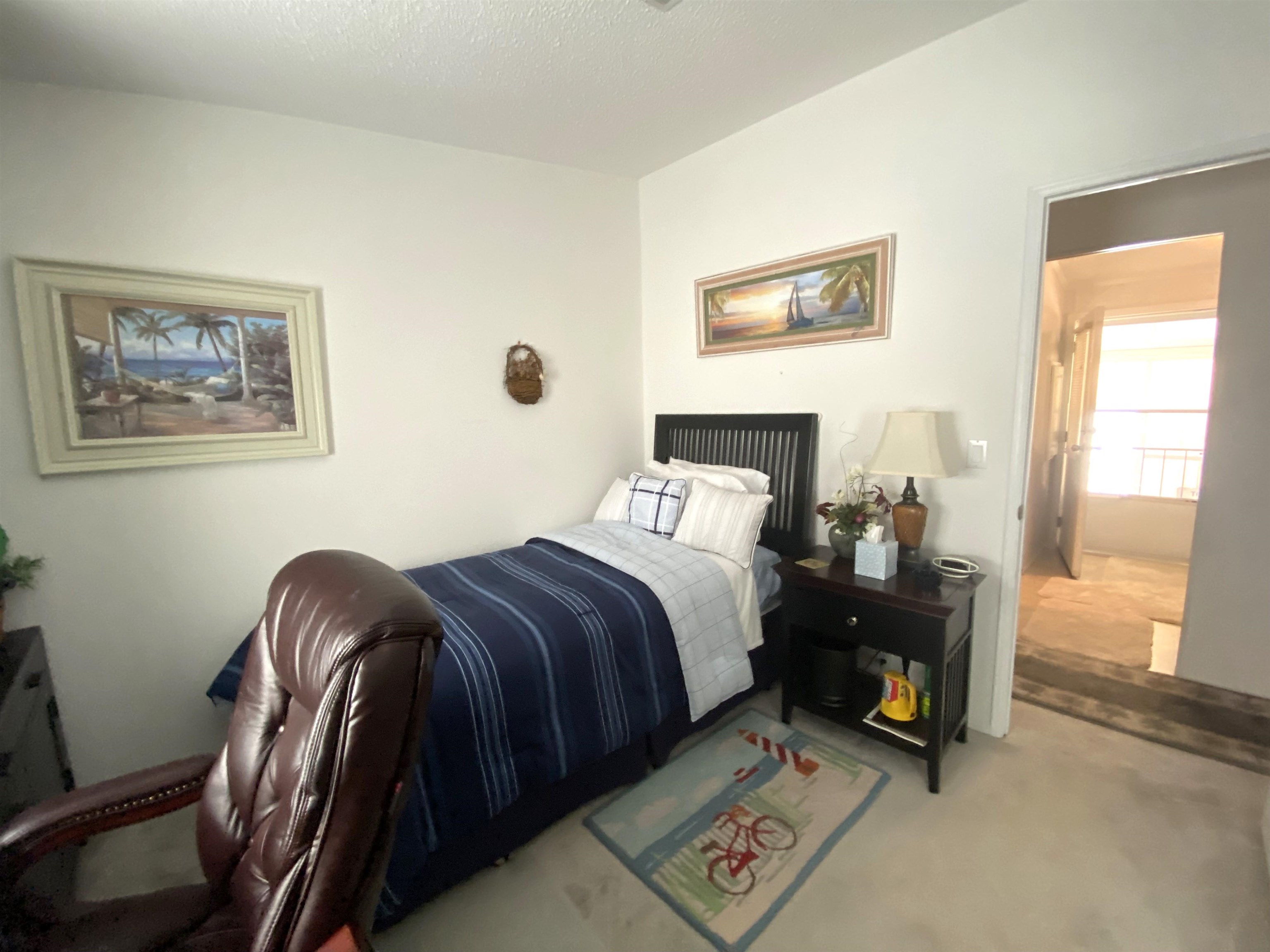 119 Anchorage Drive Beverly Beach, FL 32136 - Photo 15 of 33 a bedroom with a bed and a painting on the wall