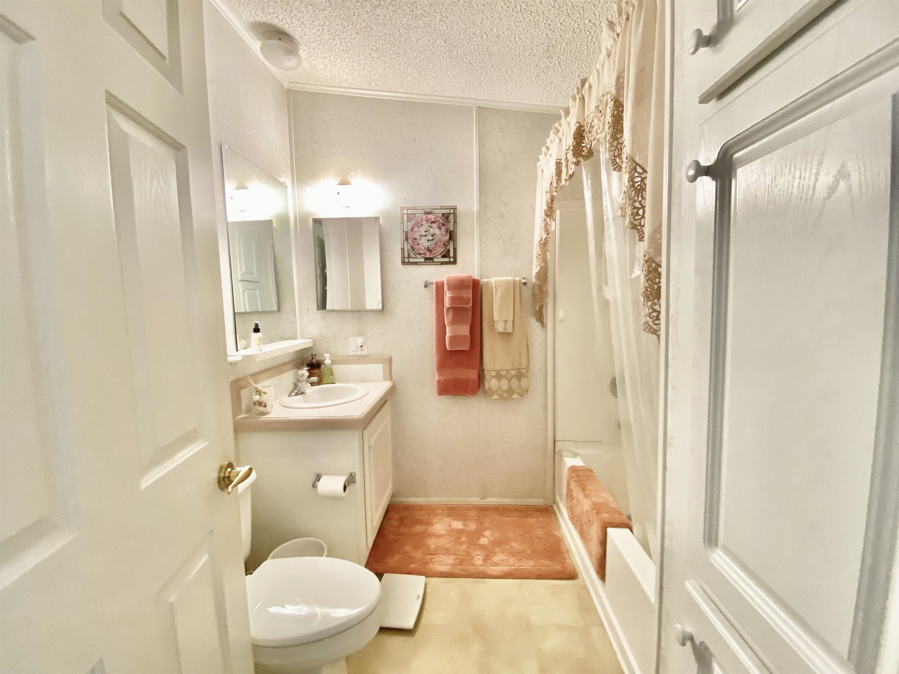 119 Anchorage Drive Beverly Beach, FL 32136 - Photo 17 of 33 a bathroom with a sink a toilet a mirror and shower