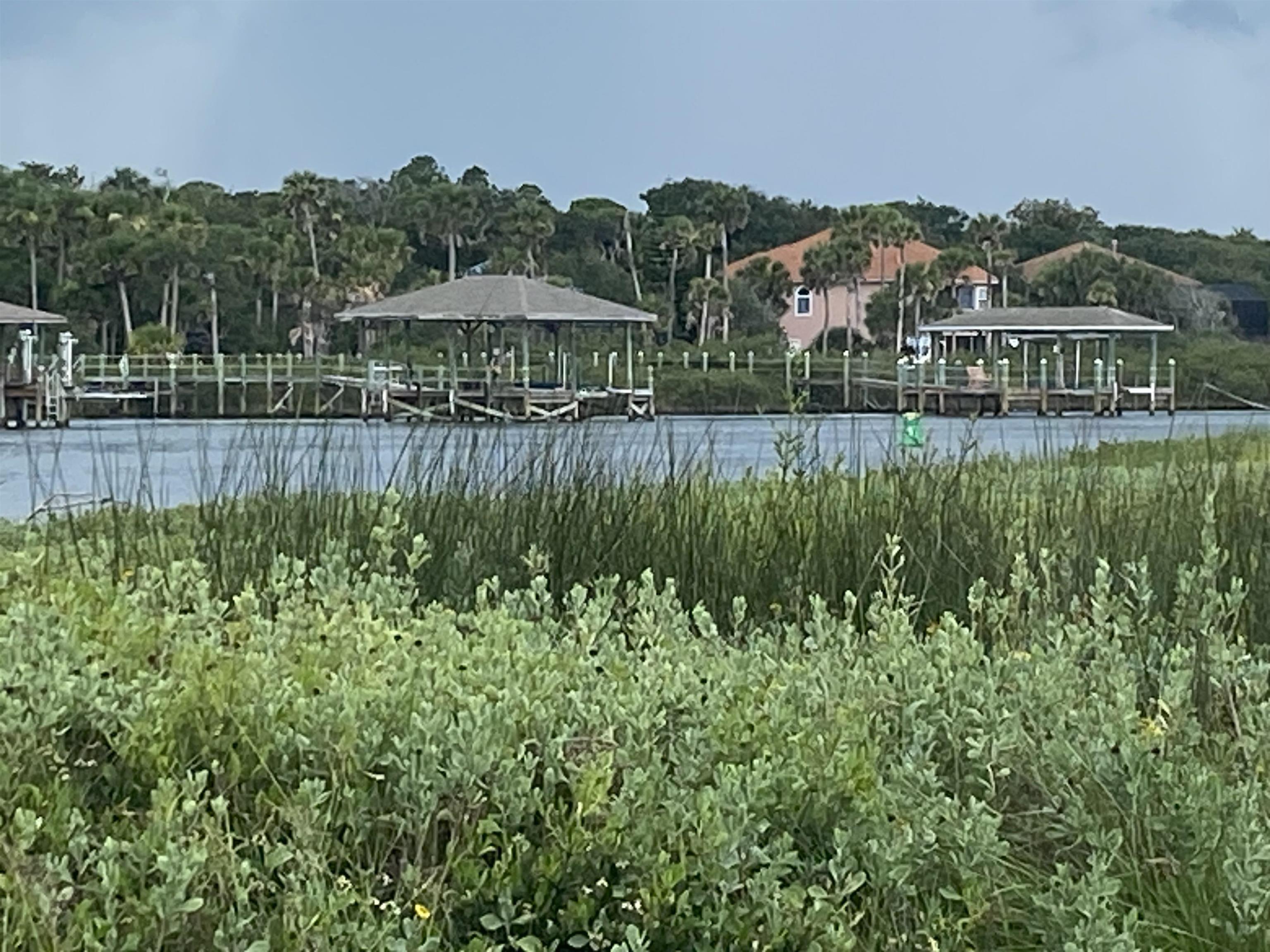 119 Anchorage Drive Beverly Beach, FL 32136 - Photo 30 of 33 a view of a lake with a house in the background