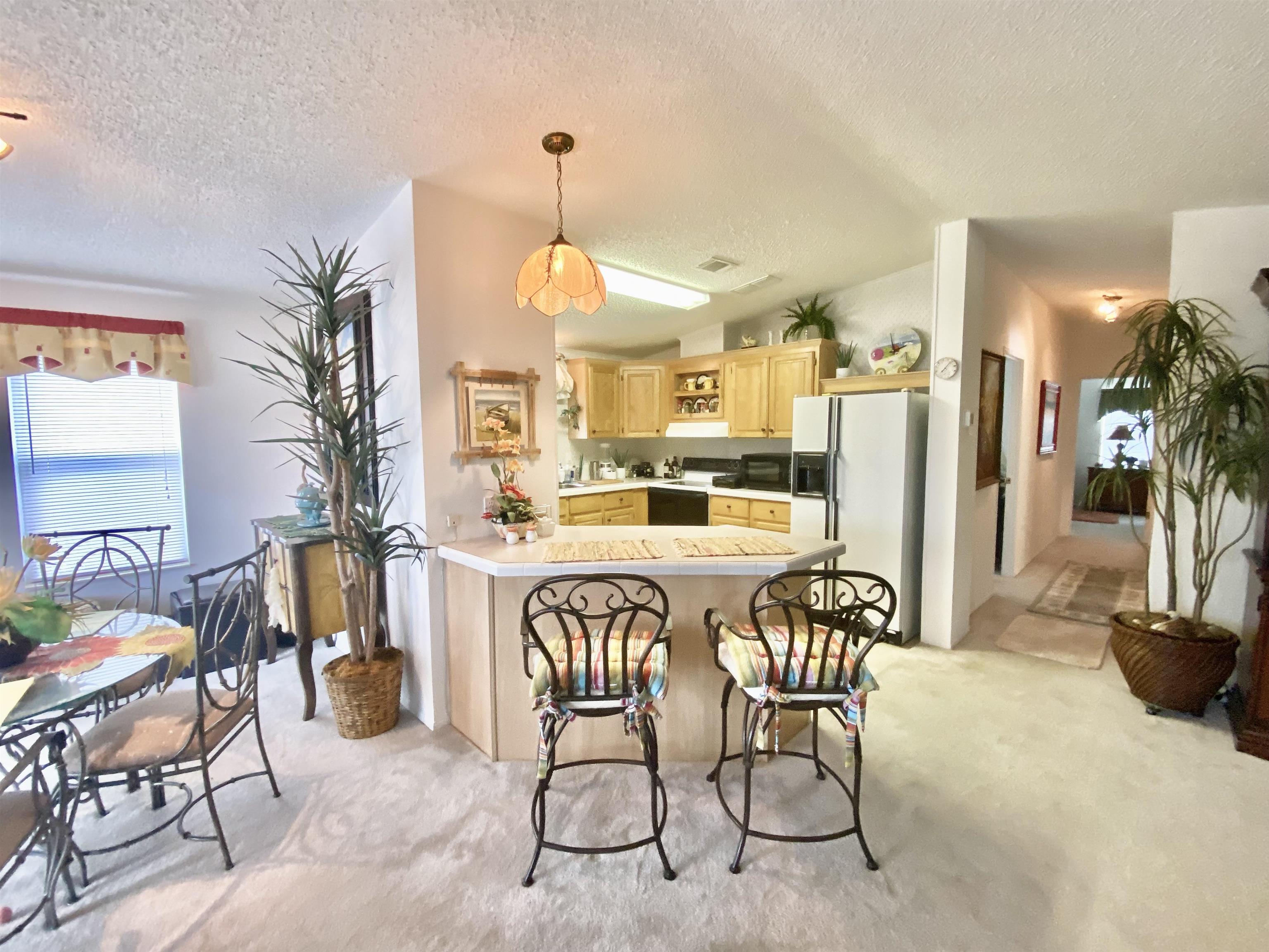 119 Anchorage Drive Beverly Beach, FL 32136 - Photo 3 of 33 a dining room with furniture and a chandelier