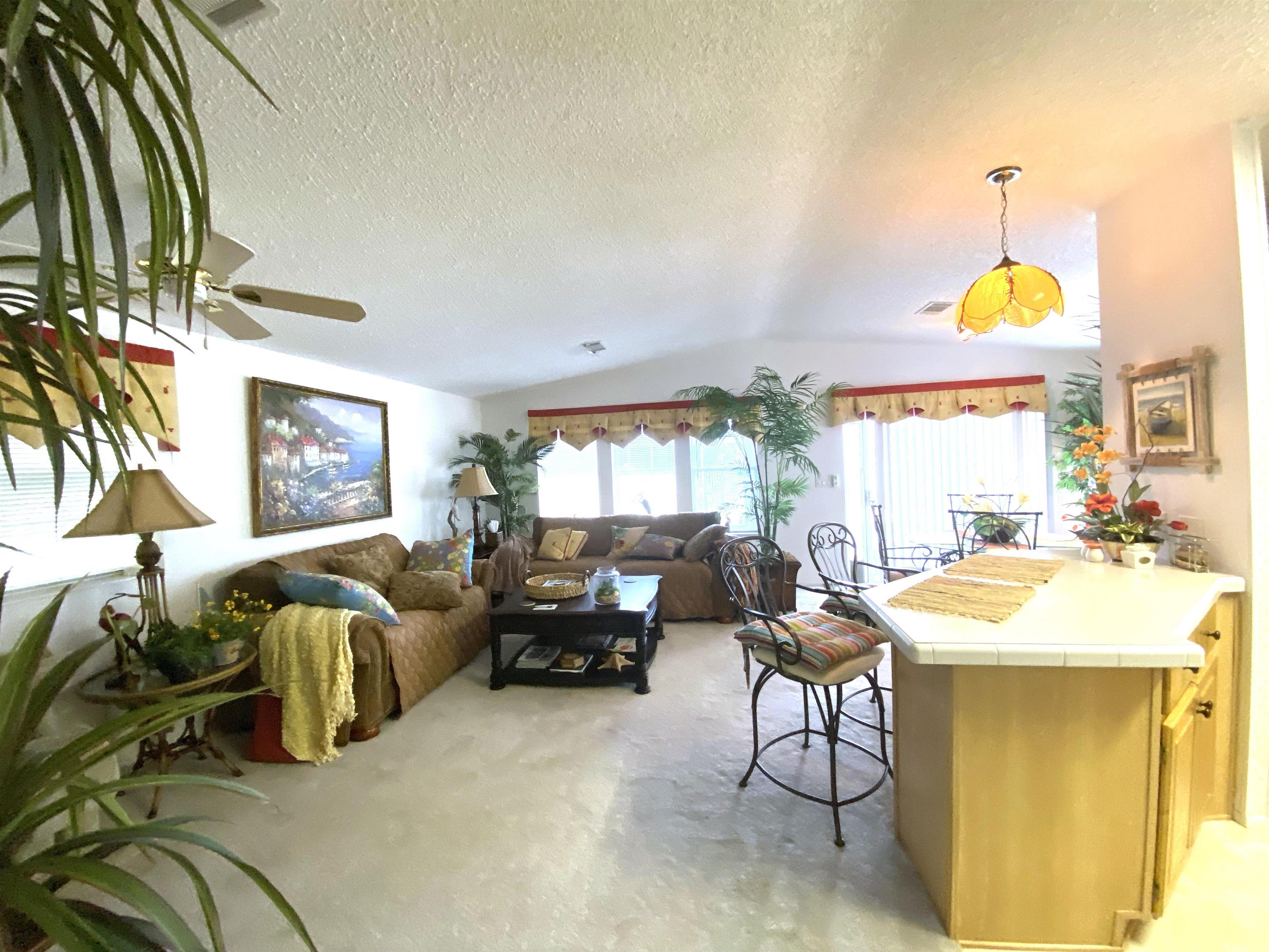 119 Anchorage Drive Beverly Beach, FL 32136 - Photo 4 of 33 a living room with furniture and a large window