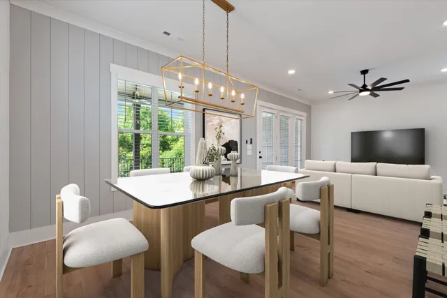 a view of a dining room with furniture window and wooden floor