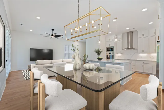 a kitchen with a sink a counter top space and living room view