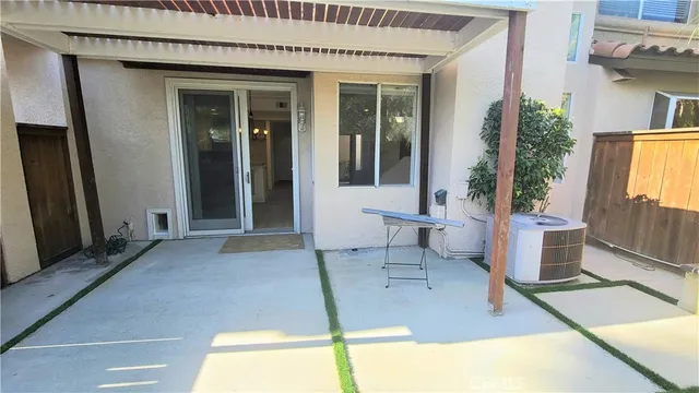 a view of an entryway with a table and chair
