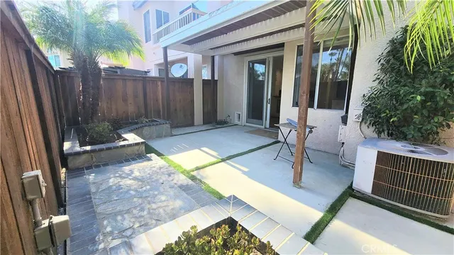 a view of backyard with a patio and outdoor seating