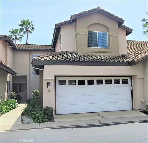 a front view of a house with a garage