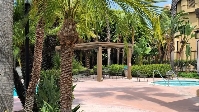 a view of a house with a tree in front