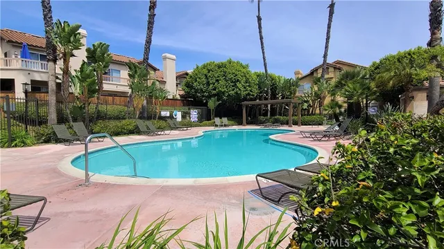 a view of a swimming pool with a patio
