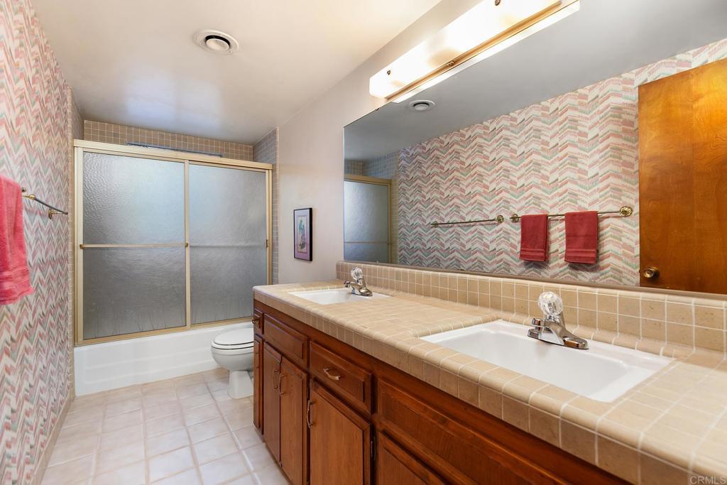 2686 Via Viejas Alpine, CA 91901 - Photo 16 of 64 a bathroom with a sink and a mirror