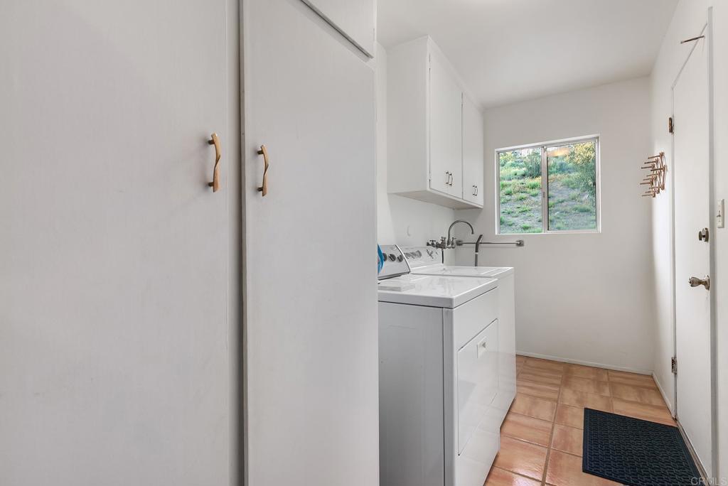 2686 Via Viejas Alpine, CA 91901 - Photo 24 of 64 a utility room with a sink a window and stainless steel appliances