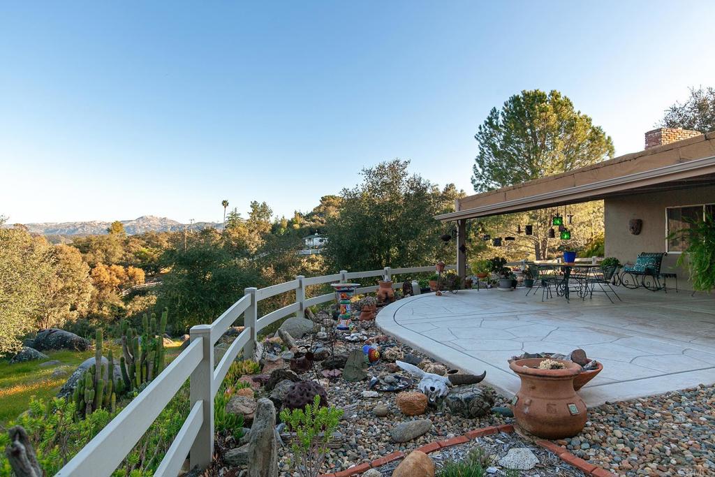2686 Via Viejas Alpine, CA 91901 - Photo 28 of 64 a view of a patio with a table chairs and a backyard
