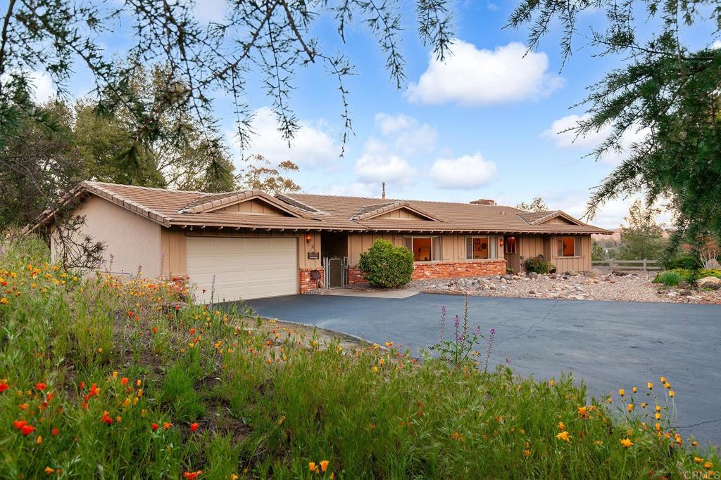 2686 Via Viejas Alpine, CA 91901 - Photo 45 of 64 a front view of a house with garden