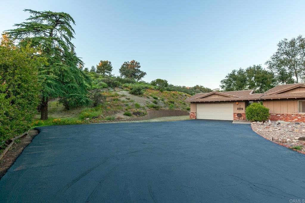2686 Via Viejas Alpine, CA 91901 - Photo 48 of 64 a view of a house with a yard and garage