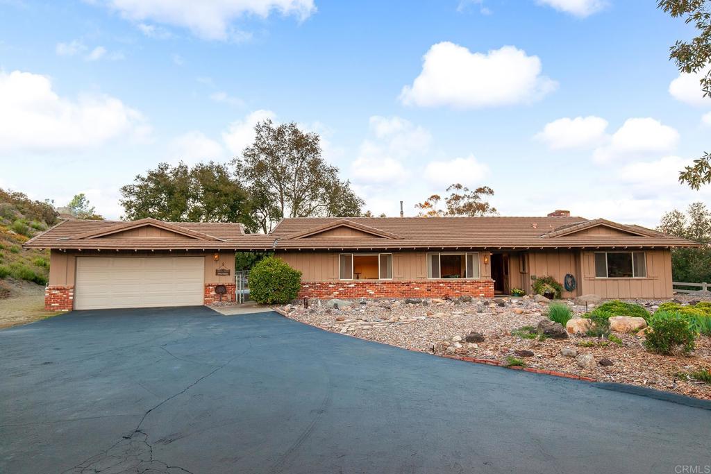 2686 Via Viejas Alpine, CA 91901 - Photo 49 of 64 a front view of a house with garden