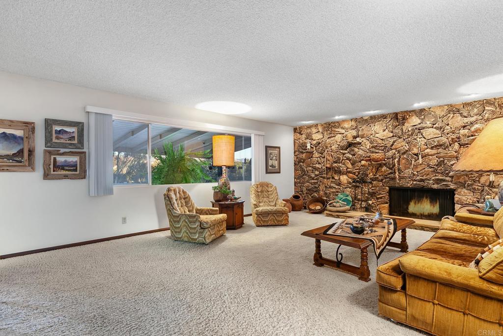 2686 Via Viejas Alpine, CA 91901 - Photo 8 of 64 a living room with furniture and a fireplace