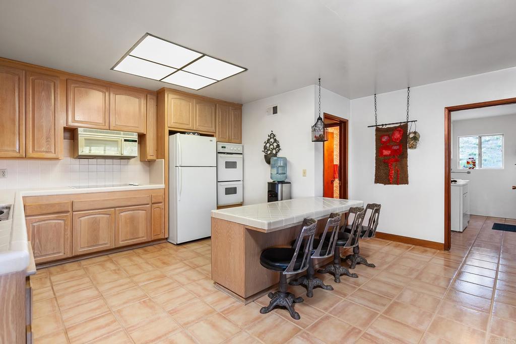 2686 Via Viejas Alpine, CA 91901 - Photo 10 of 64 a kitchen with stainless steel appliances a stove a refrigerator and a refrigerator