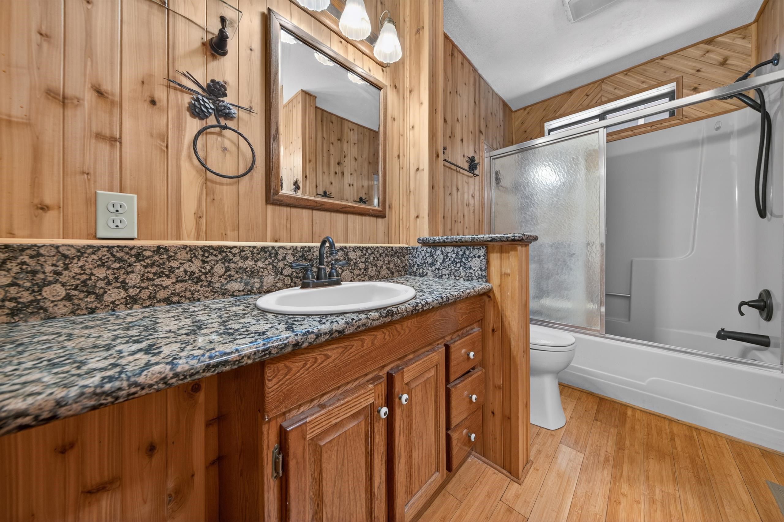 463-000 Moonlight Ranch Rd Westwood Road Susanville, CA 96130 - Photo 22 of 46 a bathroom with a granite countertop sink and a mirror