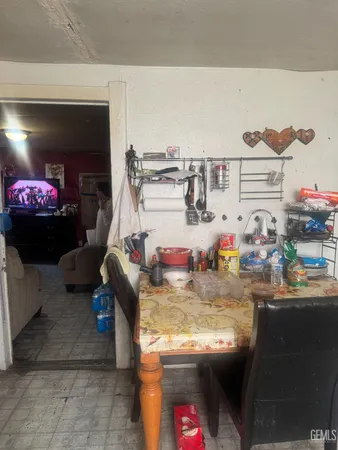 a kitchen with kitchen island a stove a sink and a microwave