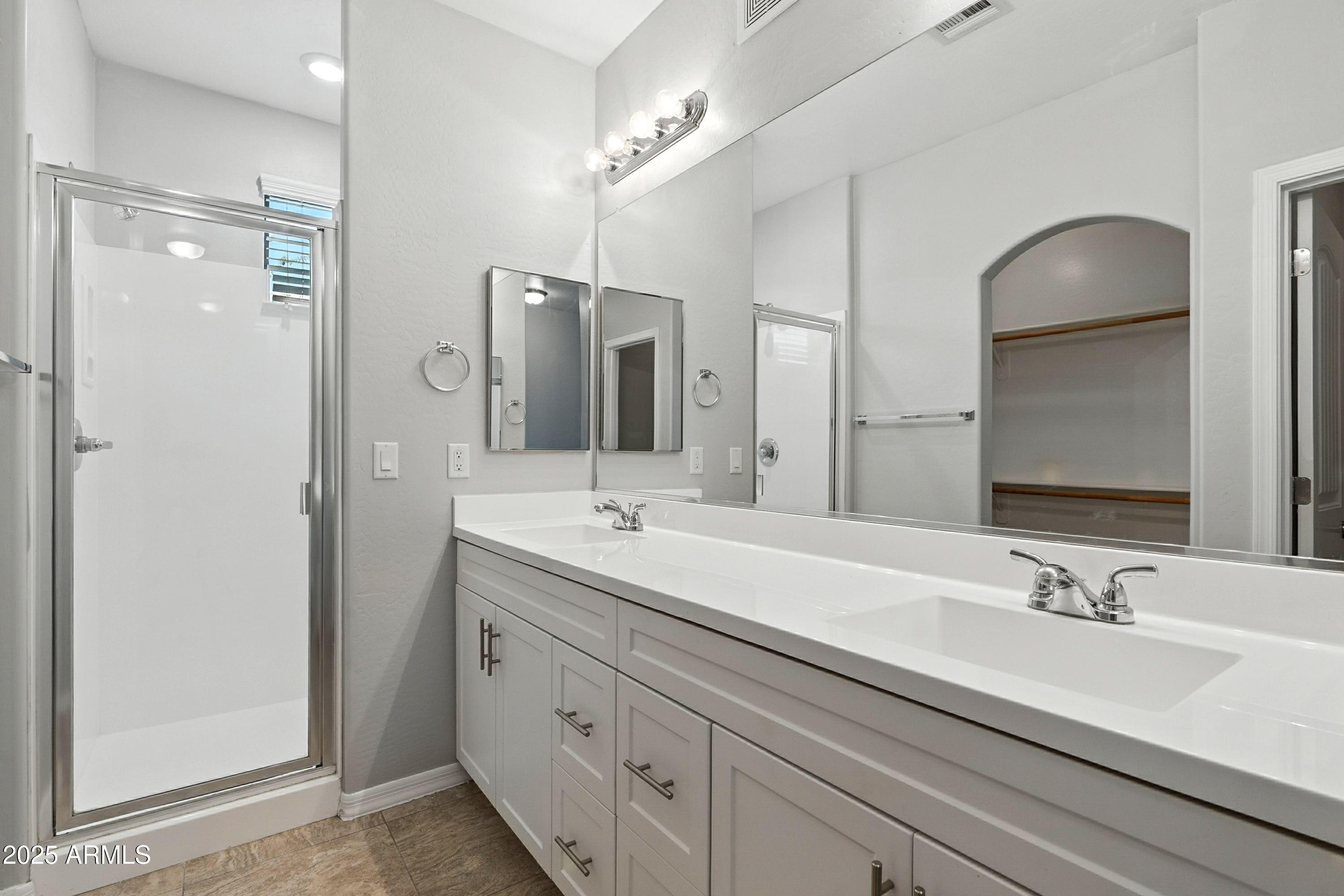 3330 South Gilbert Road, Unit 2062 Chandler, AZ 85286 - Photo 16 of 61 a bathroom with double vanity sinks and a mirror