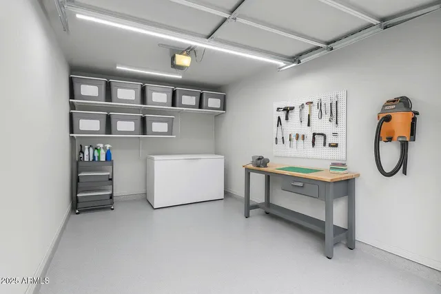 an aerial view of a house with garden space and outdoor seating