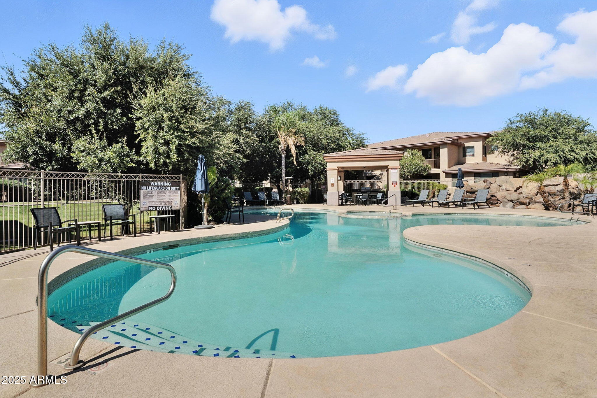 3330 South Gilbert Road, Unit 2062 Chandler, AZ 85286 - Photo 36 of 61 a view of a swimming pool with outdoor seating