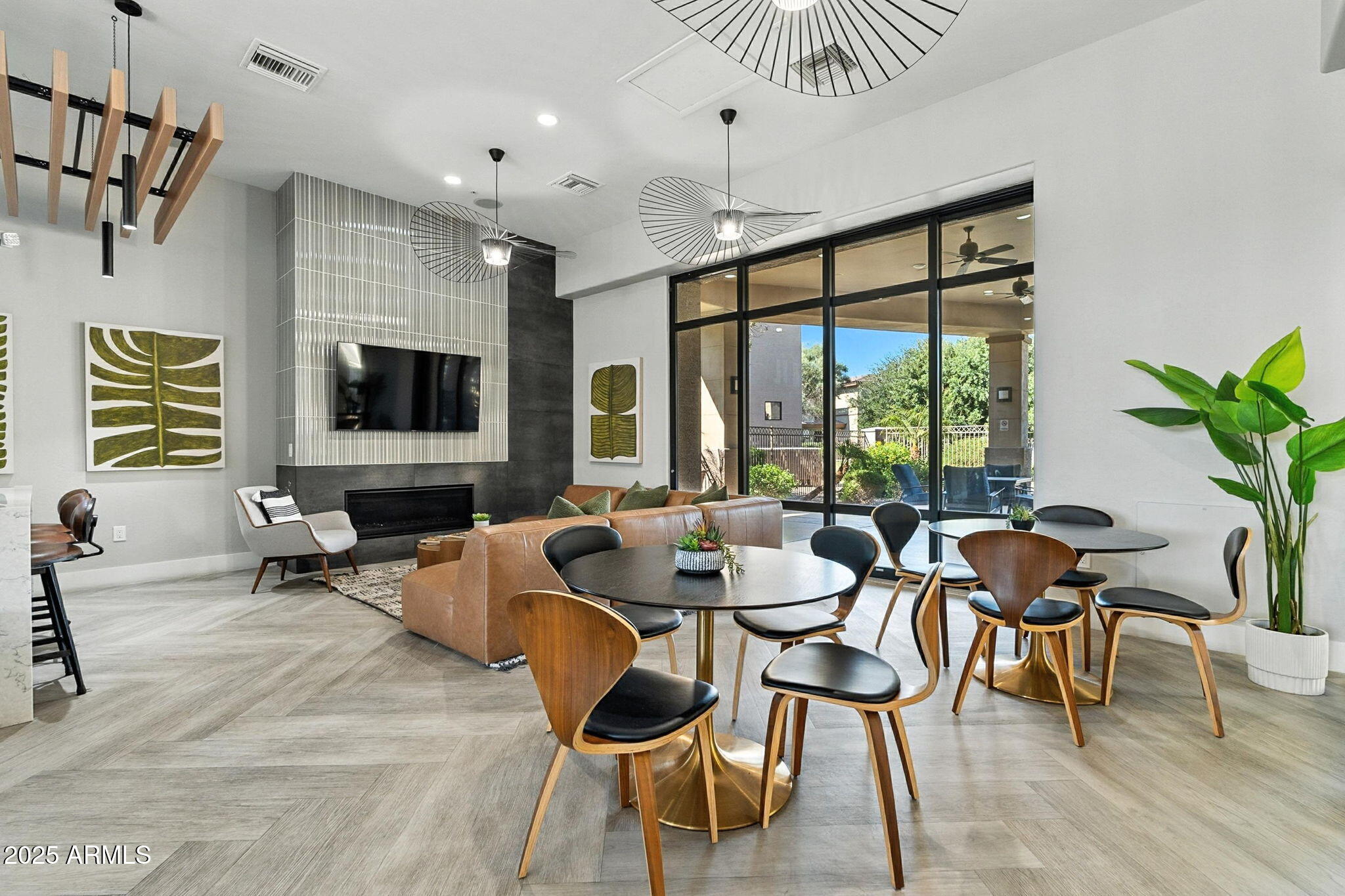 3330 South Gilbert Road, Unit 2062 Chandler, AZ 85286 - Photo 49 of 61 a dining room with furniture a flat screen tv and a large window