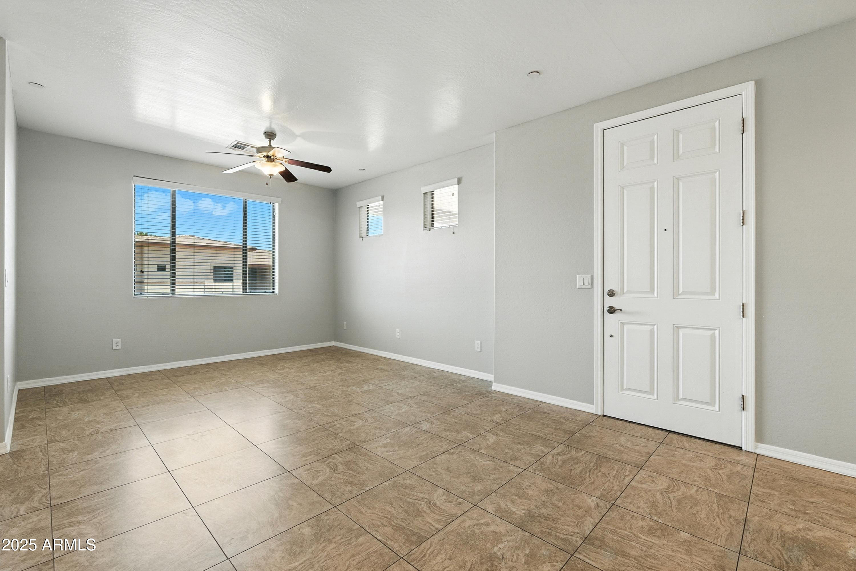 3330 South Gilbert Road, Unit 2062 Chandler, AZ 85286 - Photo 4 of 61 a view of an empty room with a window