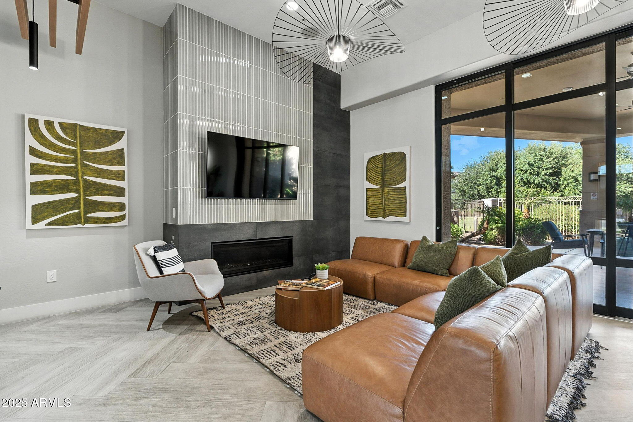 3330 South Gilbert Road, Unit 2062 Chandler, AZ 85286 - Photo 50 of 61 a living room with furniture a fireplace and a flat screen tv