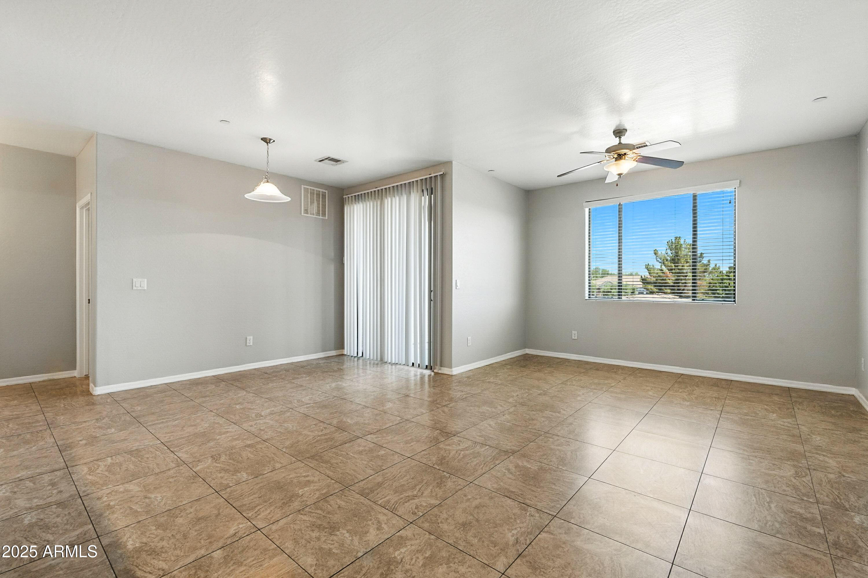 3330 South Gilbert Road, Unit 2062 Chandler, AZ 85286 - Photo 5 of 61 a view of an empty room with a window