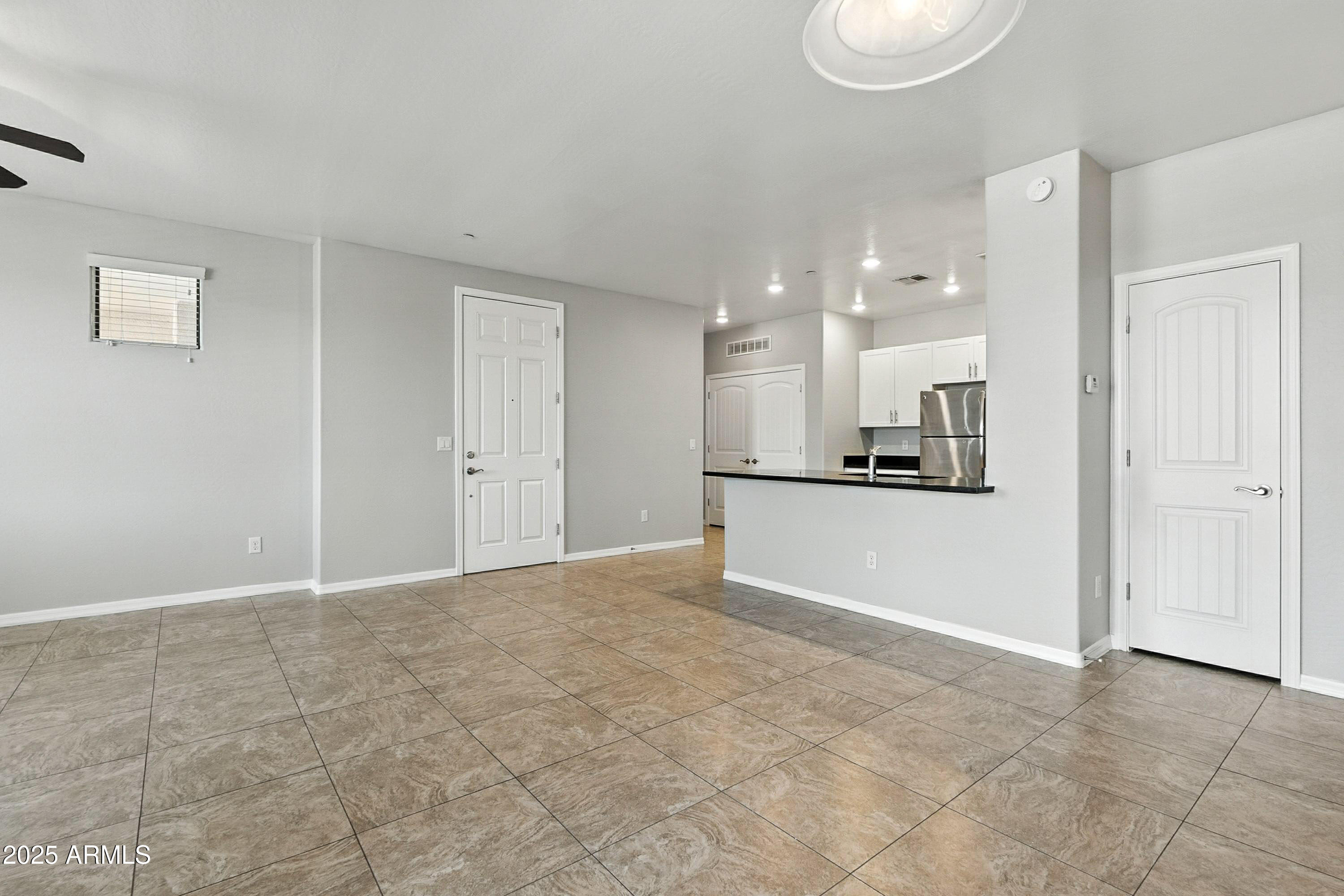 3330 South Gilbert Road, Unit 2062 Chandler, AZ 85286 - Photo 8 of 61 a view of kitchen with refrigerator and window