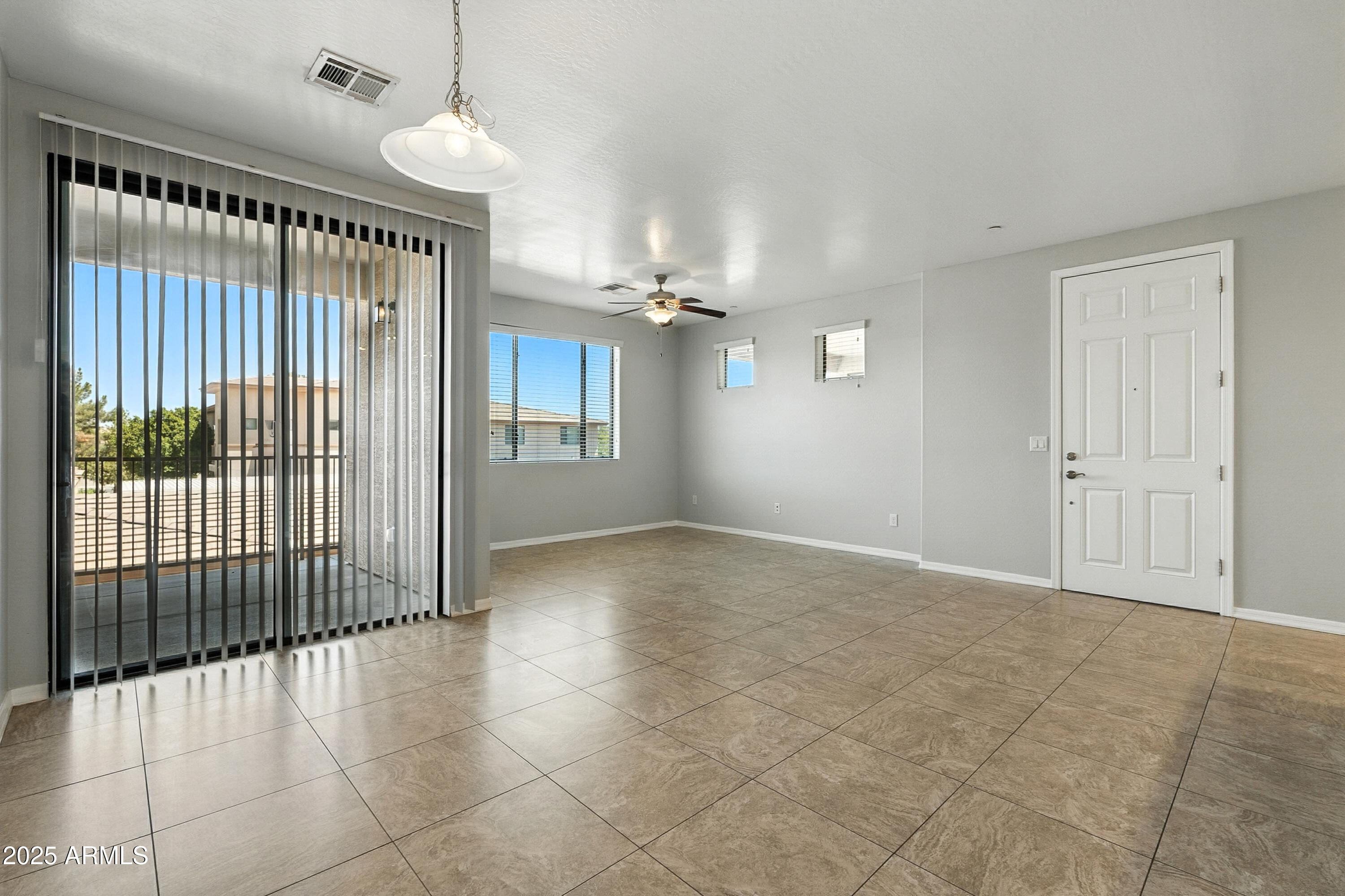 3330 South Gilbert Road, Unit 2062 Chandler, AZ 85286 - Photo 9 of 61 a view of an empty room with a window