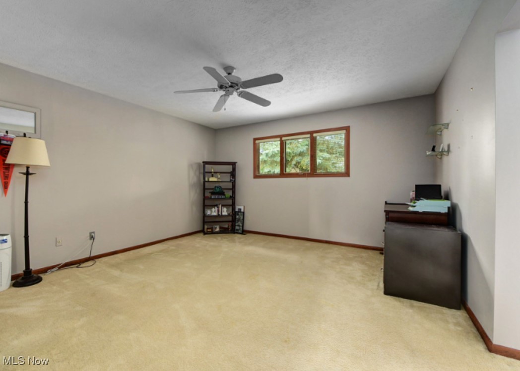 22536 Center Ridge Road, Unit A Rocky River, OH 44116 - Photo 27 of 32 Bedroom featuring light colored carpet with ceiling fan