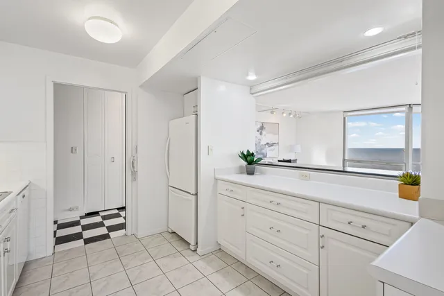 a spacious bathroom with a double vanity sink and a mirror