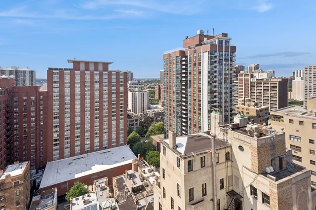 a view of a city with tall buildings