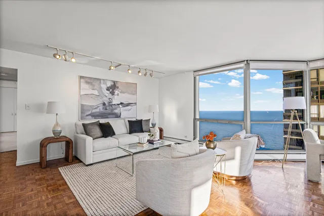 a living room with furniture and a large window