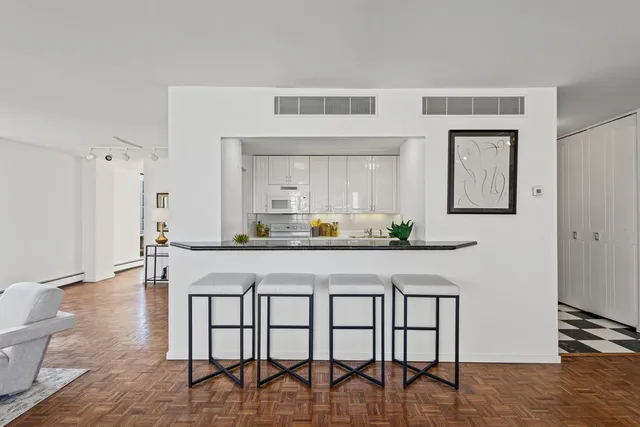 a kitchen with a table and chairs in it