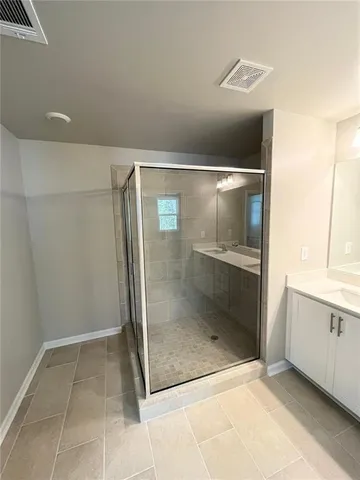 a view of hallway with bathroom