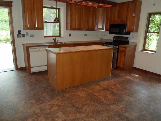 1530 Riverside Avenue St. Charles, IL 60174 - Photo 2 of 10 a room with wooden cabinets washer and dryer