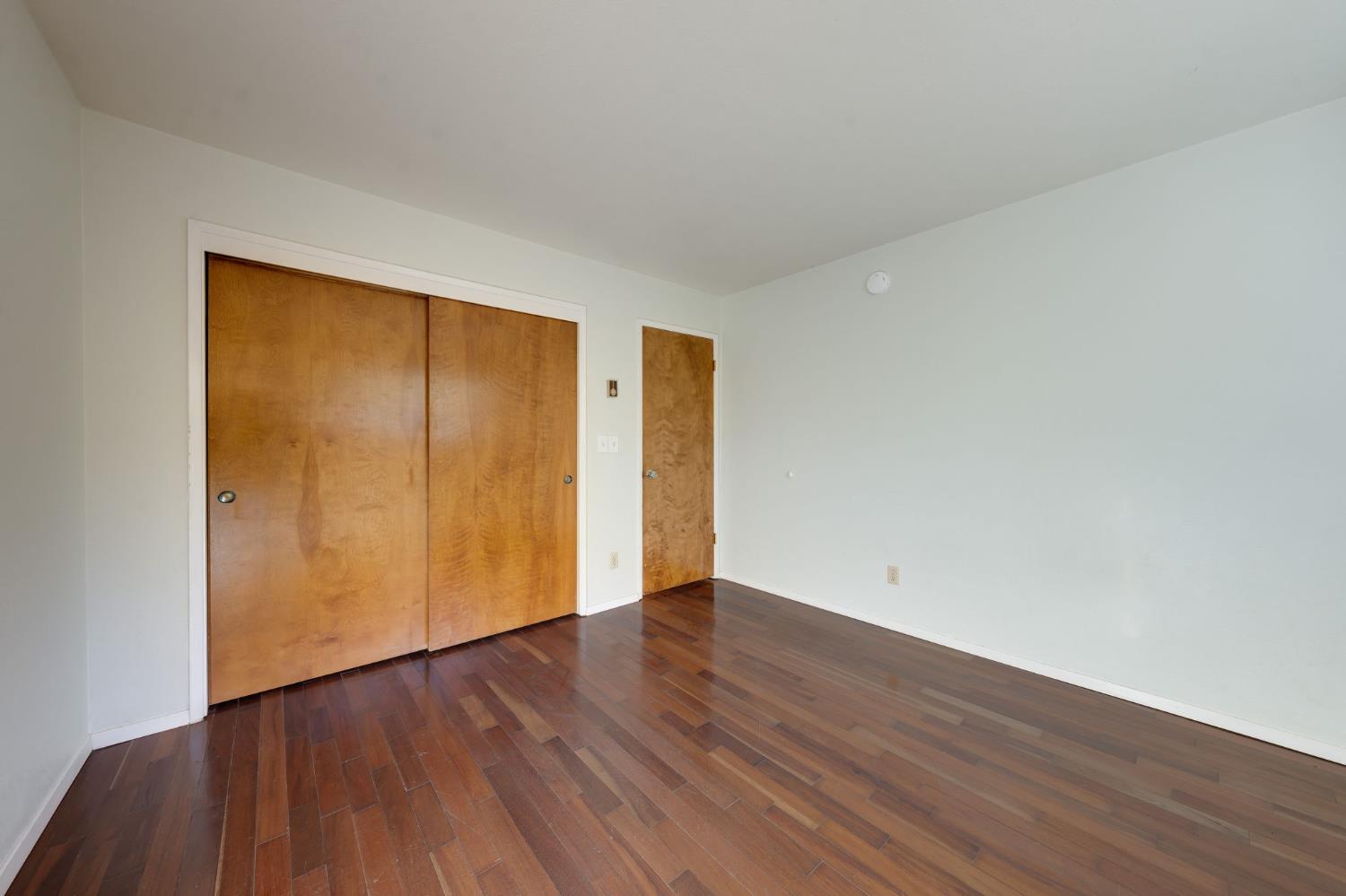 6139 Shad Way Pollock Pines, CA 95726 - Photo 16 of 49 a view of an empty room with wooden floor
